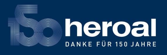 Jubiläumslogo von heroal mit der Zahl 150 und dem Schriftzug „Danke für 150 Jahre“ auf dunkelblauem Hintergrund.